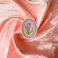 Decorative sticker with a tulip design on pink fabric